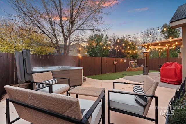 patio terrace at dusk featuring an outdoor hangout area, grilling area, and a hot tub