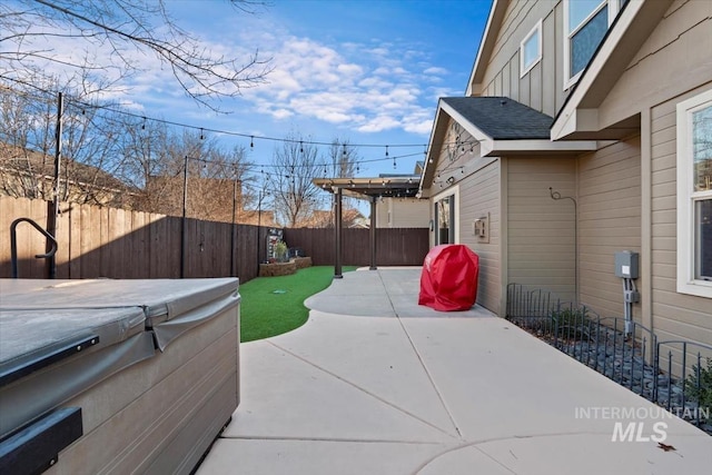 view of patio / terrace featuring a hot tub