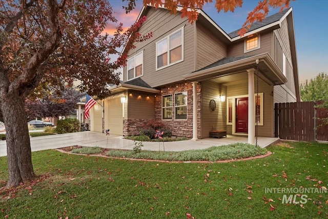 view of front facade with a lawn and a garage