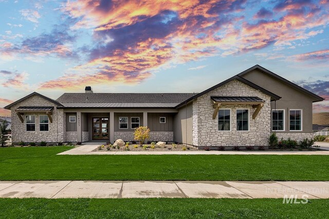 view of front of property with a yard