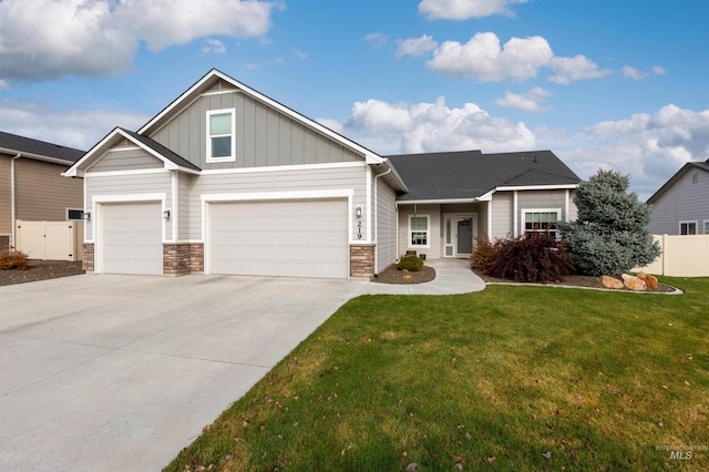 view of front facade with a front yard and a garage