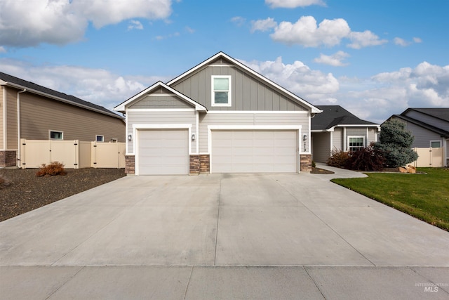 view of front facade with a garage and a front lawn