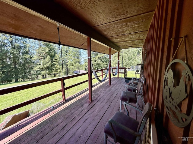 170 Red Fir Rd, Kooskia, ID 83539 - wooden terrace featuring a lawn and view of wooded area