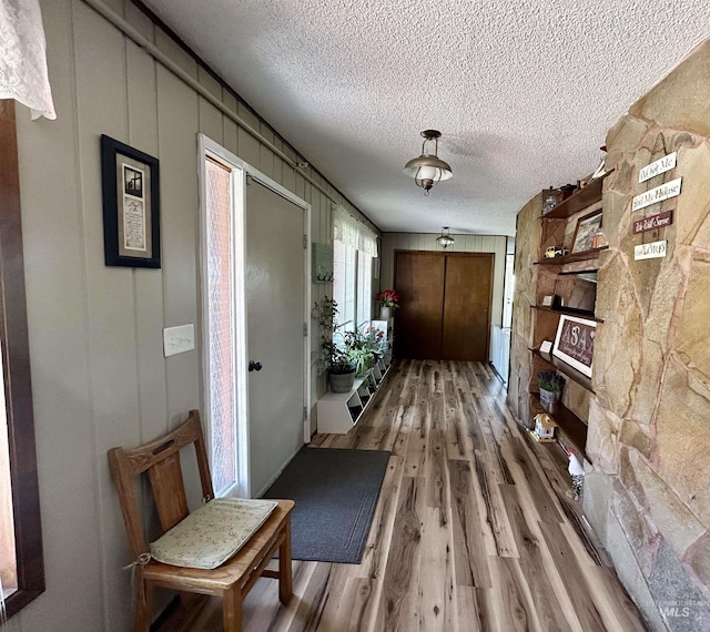 170 Red Fir Rd, Kooskia, ID 83539 - hallway featuring wood finished floors and a textured ceiling