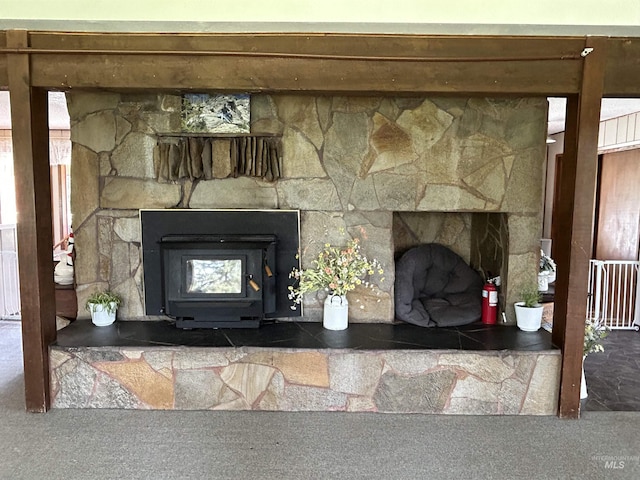 170 Red Fir Rd, Kooskia, ID 83539 - detailed view of a fire extinguisher, a wood stove, and carpet flooring