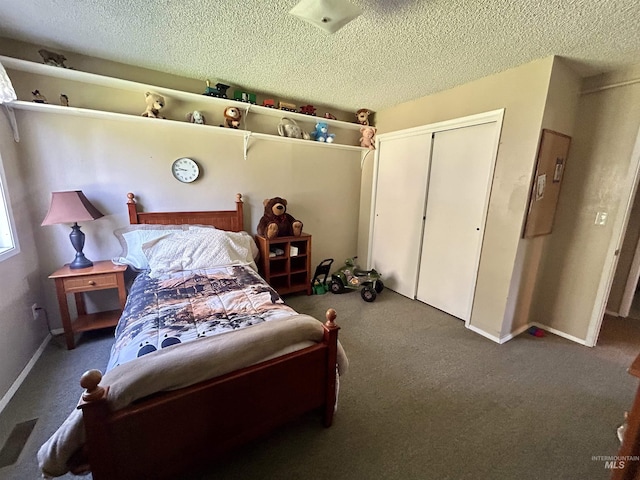 170 Red Fir Rd, Kooskia, ID 83539 - carpeted bedroom featuring a closet, a textured ceiling, and baseboards