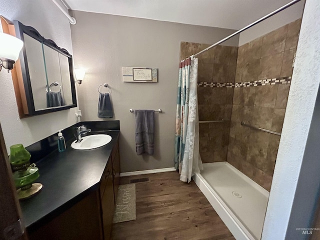 170 Red Fir Rd, Kooskia, ID 83539 - full bathroom featuring a shower stall, vanity, and wood finished floors