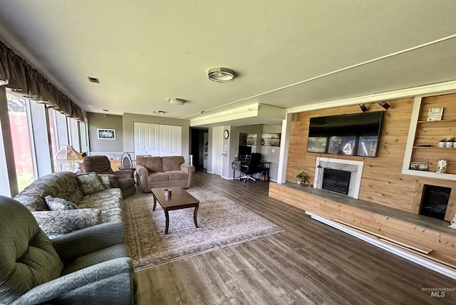 170 Red Fir Rd, Kooskia, ID 83539 - living room with a fireplace with raised hearth, wood finished floors, and wooden walls