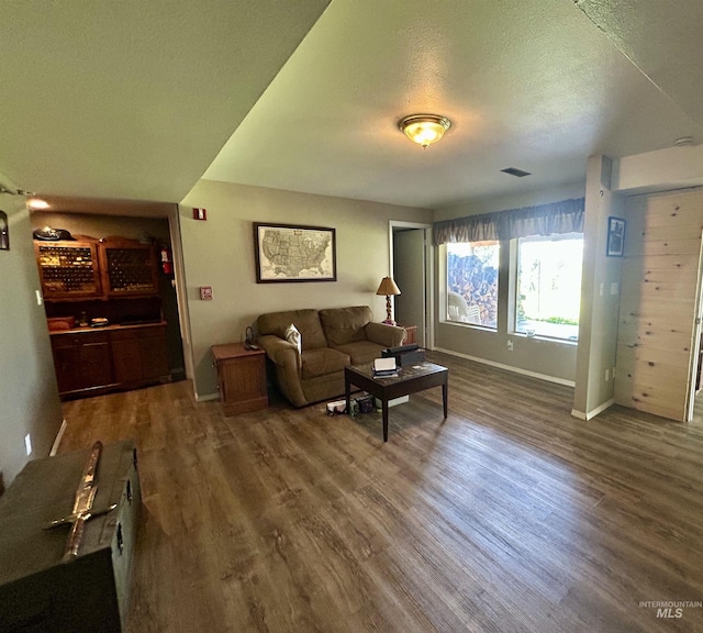 170 Red Fir Rd, Kooskia, ID 83539 - living area featuring wood finished floors, baseboards, and a textured ceiling