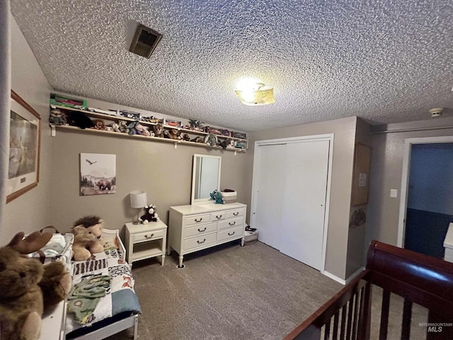 170 Red Fir Rd, Kooskia, ID 83539 - bedroom with carpet flooring, a textured ceiling, and a closet