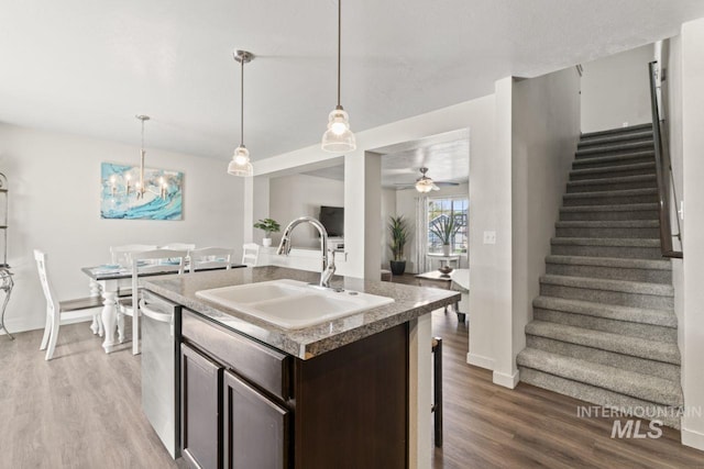 4249 W Farlam Dr, Meridian, ID 83642 - kitchen with a sink, dark brown cabinetry, wood finished floors, and dishwasher
