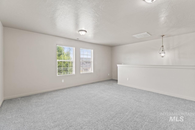 4249 W Farlam Dr, Meridian, ID 83642 - carpeted spare room with a textured ceiling and baseboards