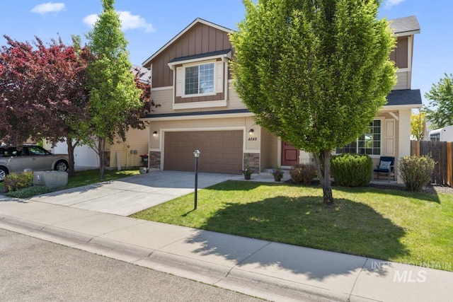 4249 W Farlam Dr, Meridian, ID 83642 - view of front of home featuring board and batten siding, a garage, driveway, and stone siding