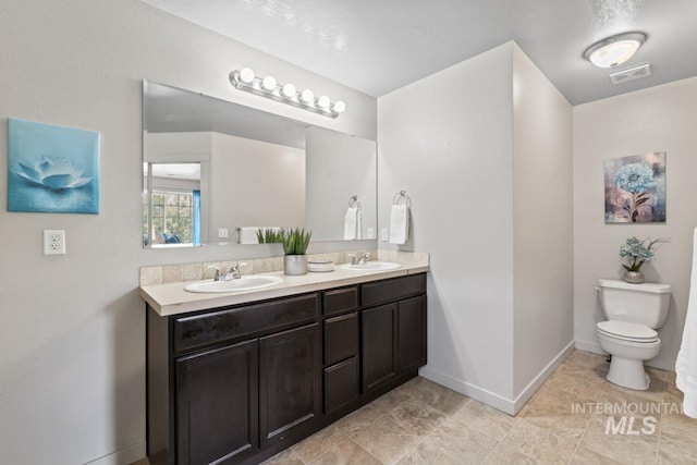 4249 W Farlam Dr, Meridian, ID 83642 - full bath with double vanity, toilet, and baseboards
