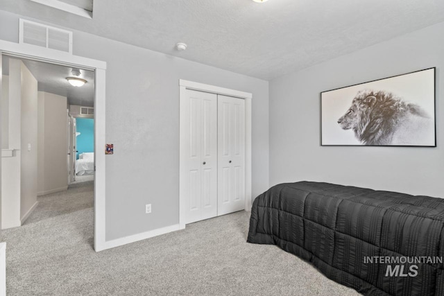 4249 W Farlam Dr, Meridian, ID 83642 - carpeted bedroom with baseboards, a closet, and a textured ceiling