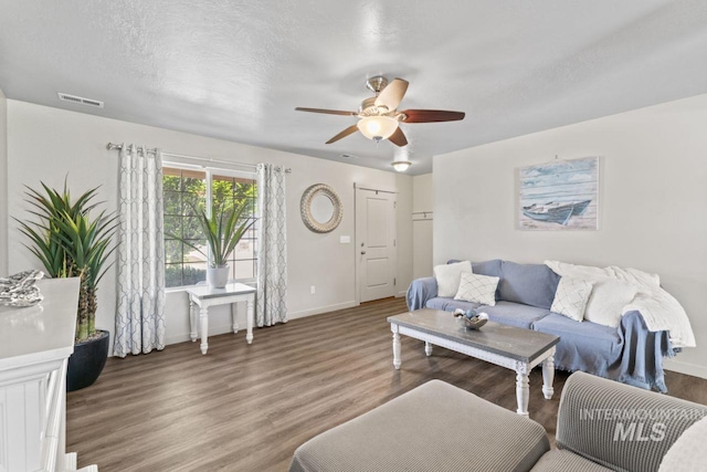 4249 W Farlam Dr, Meridian, ID 83642 - living area featuring ceiling fan, wood finished floors, and baseboards