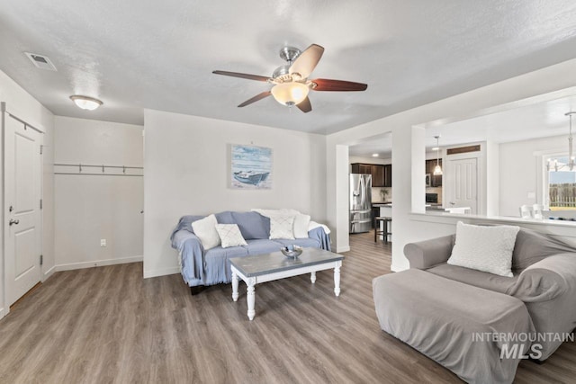4249 W Farlam Dr, Meridian, ID 83642 - living room with ceiling fan, wood finished floors, and baseboards