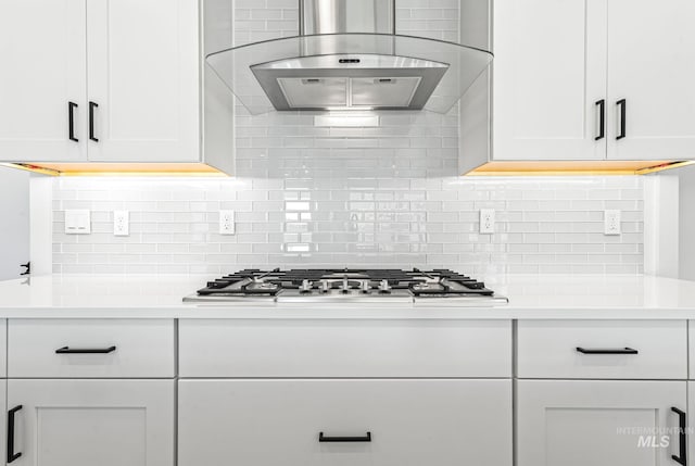 2398 N Klemmer Ave, Kuna, ID 83634 - kitchen with exhaust hood, stainless steel gas cooktop, white cabinetry, and light countertops