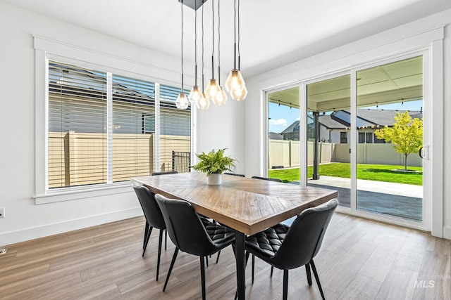 2398 N Klemmer Ave, Kuna, ID 83634 - dining space featuring wood finished floors and a chandelier