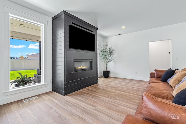 2398 N Klemmer Ave, Kuna, ID 83634 - living area with light wood-type flooring, a large fireplace, and recessed lighting