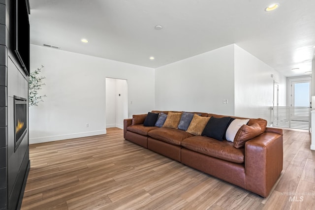 2398 N Klemmer Ave, Kuna, ID 83634 - living area featuring light wood-type flooring, a fireplace, and recessed lighting