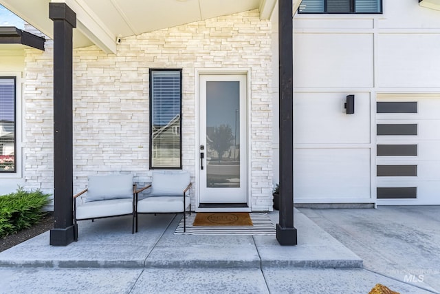 2398 N Klemmer Ave, Kuna, ID 83634 - doorway to property with stone siding and a garage