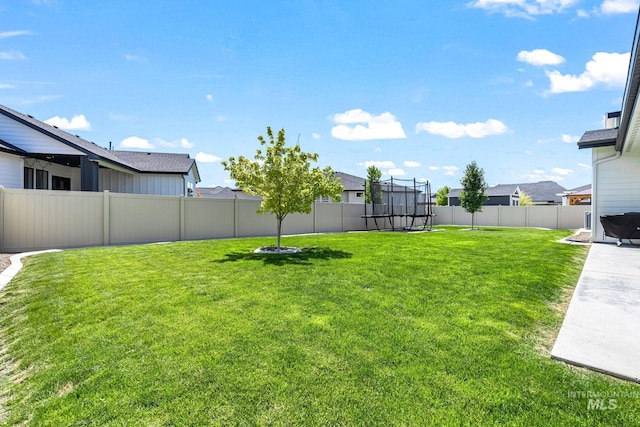 2398 N Klemmer Ave, Kuna, ID 83634 - fenced backyard featuring a trampoline and a residential view