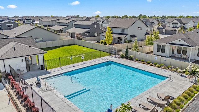 2398 N Klemmer Ave, Kuna, ID 83634 - community pool featuring a residential view, a fenced backyard, and a patio area