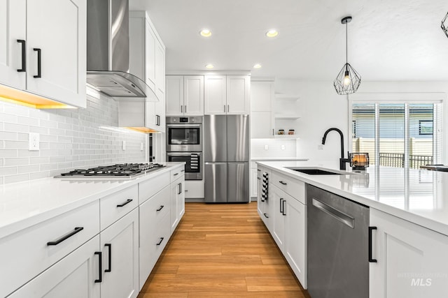 2398 N Klemmer Ave, Kuna, ID 83634 - kitchen with stainless steel appliances, wall chimney exhaust hood, open shelves, backsplash, and recessed lighting