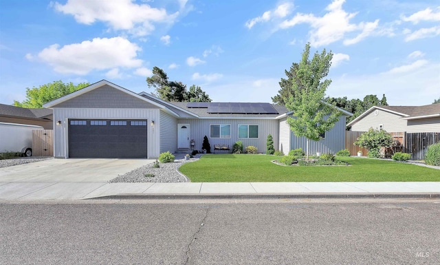 680 E 19th St, Burley, ID 83318 - single story home featuring solar panels, an attached garage, and driveway