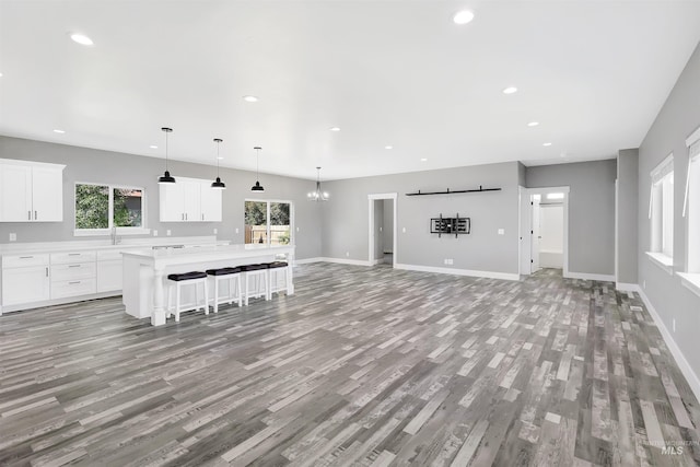 680 E 19th St, Burley, ID 83318 - living room with light wood-type flooring, plenty of natural light, baseboards, and recessed lighting
