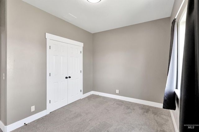 680 E 19th St, Burley, ID 83318 - unfurnished bedroom featuring baseboards, carpet floors, and a closet