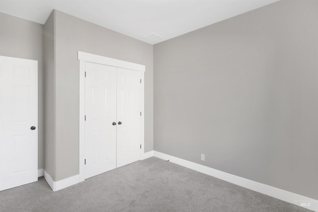 680 E 19th St, Burley, ID 83318 - unfurnished bedroom featuring carpet flooring, a closet, and baseboards