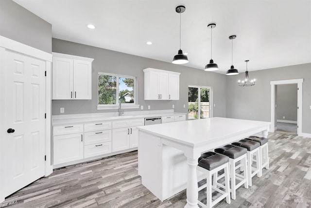 680 E 19th St, Burley, ID 83318 - kitchen with light countertops, plenty of natural light, a center island, light wood-style floors, and recessed lighting