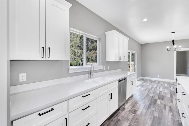 680 E 19th St, Burley, ID 83318 - kitchen featuring stainless steel dishwasher, a sink, plenty of natural light, light countertops, and recessed lighting