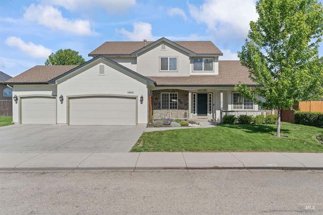 1992 S Elkhound Ave, Meridian, ID 83642 - view of front of property with a porch, a garage, concrete driveway, and a shingled roof
