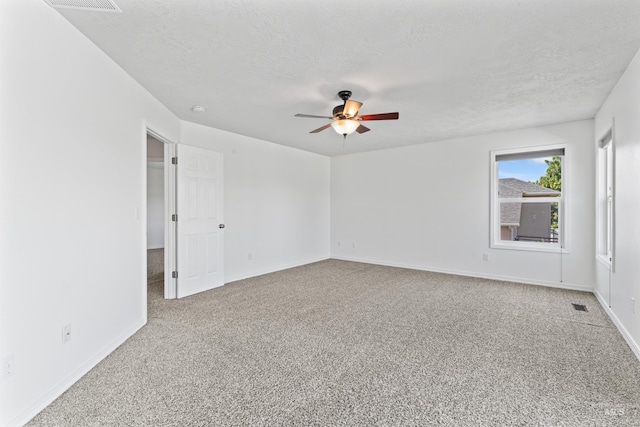 1992 S Elkhound Ave, Meridian, ID 83642 - carpeted spare room featuring a ceiling fan, a textured ceiling, baseboards, and a smoke detector