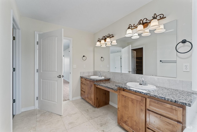 1992 S Elkhound Ave, Meridian, ID 83642 - full bathroom featuring double vanity, tile patterned flooring, and baseboards