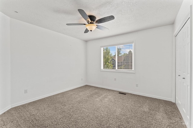 1992 S Elkhound Ave, Meridian, ID 83642 - unfurnished bedroom with a closet, carpet floors, a textured ceiling, baseboards, and ceiling fan