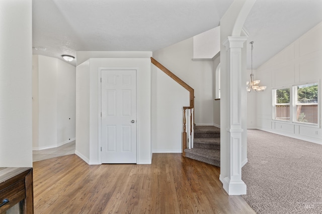 1992 S Elkhound Ave, Meridian, ID 83642 - stairs featuring arched walkways, lofted ceiling, wood finished floors, decorative columns, and baseboards