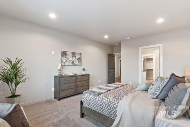 bedroom featuring light colored carpet