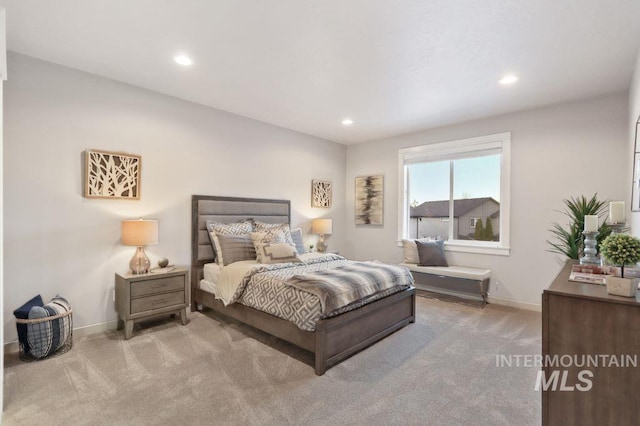 bedroom featuring light carpet