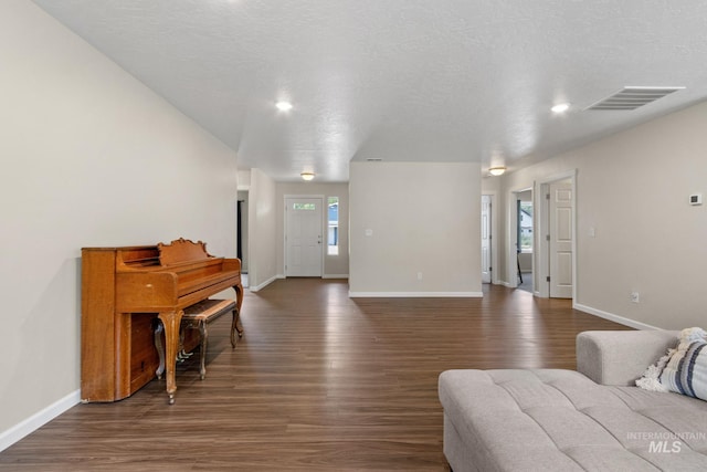 207 Lainey Ln, Idaho City, ID 83631 - living room featuring baseboards and dark wood-style flooring