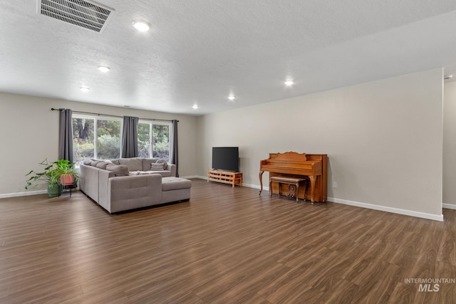 207 Lainey Ln, Idaho City, ID 83631 - living area with wood finished floors, recessed lighting, and a textured ceiling