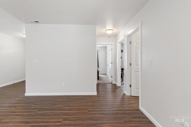 207 Lainey Ln, Idaho City, ID 83631 - hallway featuring dark wood-style floors and baseboards