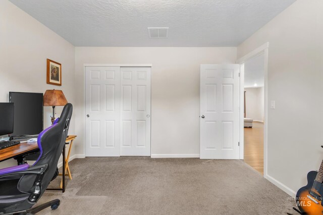 207 Lainey Ln, Idaho City, ID 83631 - carpeted office featuring baseboards and a textured ceiling