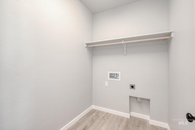 washroom featuring hookup for a washing machine, laundry area, baseboards, light wood-type flooring, and electric dryer hookup