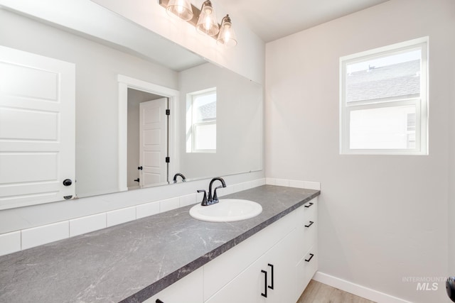 bathroom featuring vanity and baseboards