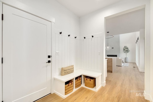 mudroom with light hardwood / wood-style floors