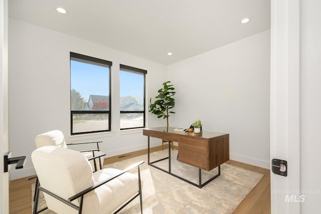 office space featuring light hardwood / wood-style floors